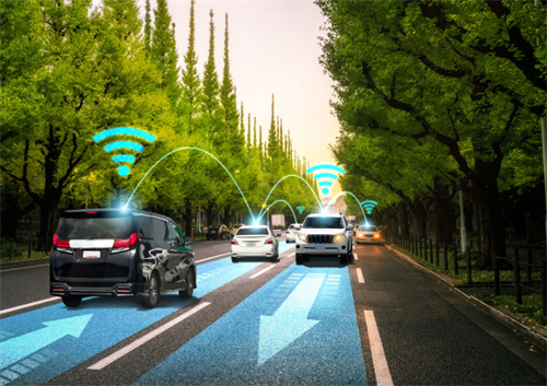 Vehicles on a street connected via V2X Wi-Fi signals, illustrating how cars communicate with each other and infrastructure.