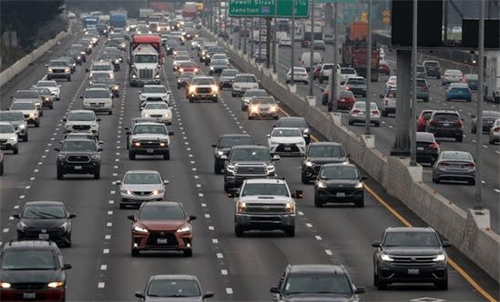 Heavy traffic on a busy highway, representing the large pool of vehicles where solid-state batteries could reduce fire risks and affect insurance rates.