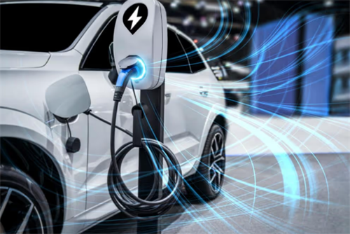 An electric car connected to a fast charger, symbolizing how solid-state battery advancements may impact existing EV resale value.
